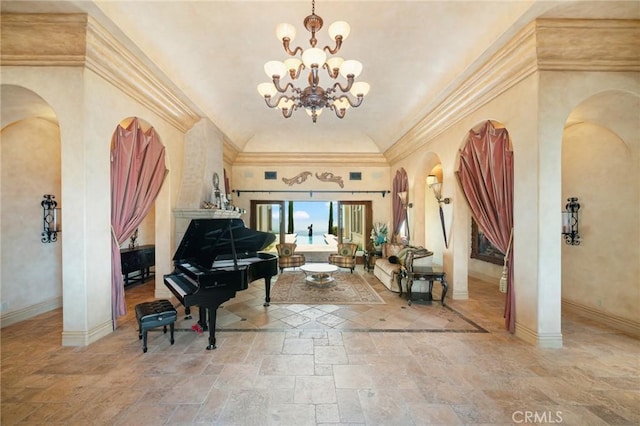 7811 Camino De Arriba, Rancho Santa Fe, CA 92067 - sitting room featuring arched walkways, stone tile flooring, baseboards, a chandelier, and ornamental molding