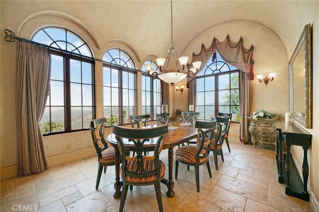 7811 Camino De Arriba, Rancho Santa Fe, CA 92067 - dining room featuring stone tile floors, healthy amount of natural light, high vaulted ceiling, and baseboards