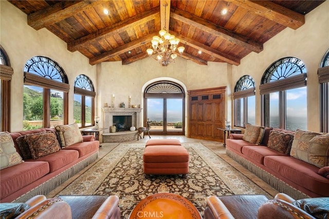 7811 Camino De Arriba, Rancho Santa Fe, CA 92067 - living room featuring wooden ceiling, high vaulted ceiling, a chandelier, beamed ceiling, and a fireplace with raised hearth