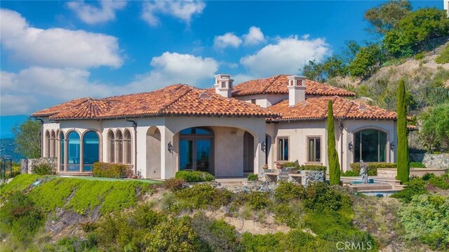 7811 Camino De Arriba, Rancho Santa Fe, CA 92067 - rear view of property with stucco siding, a chimney, and a tiled roof