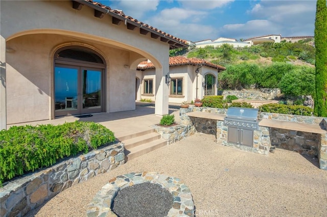 7811 Camino De Arriba, Rancho Santa Fe, CA 92067 - view of patio / terrace featuring an outdoor kitchen, a grill, and french doors