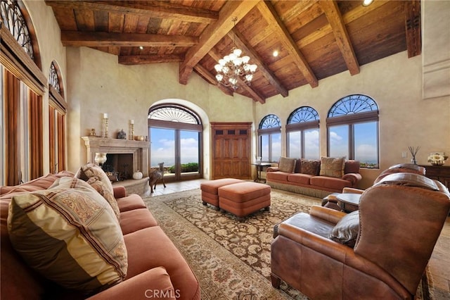7811 Camino De Arriba, Rancho Santa Fe, CA 92067 - living room featuring high vaulted ceiling, wood ceiling, beam ceiling, a chandelier, and a fireplace