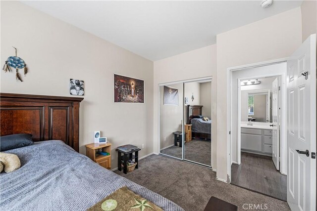 bedroom with carpet flooring, a closet, and baseboards