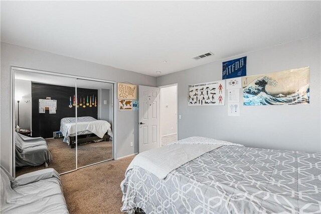 carpeted bedroom featuring a closet