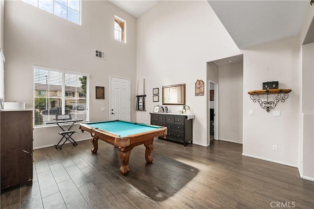 game room with a towering ceiling, dark wood-type flooring, pool table, and baseboards