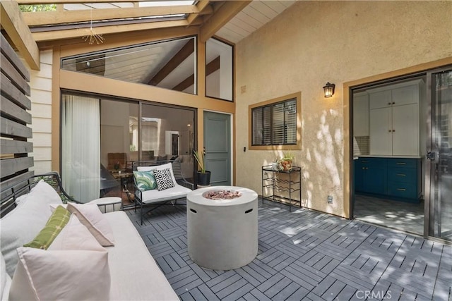 view of patio featuring an outdoor living space with a fire pit