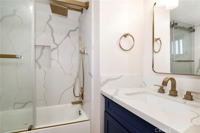 bathroom with vanity and shower / bath combination with glass door