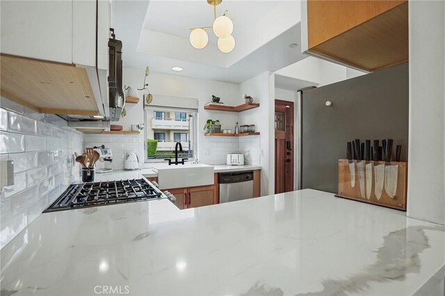 14702 Magnolia Blvd Unit 104, Sherman Oaks, CA 91403 - kitchen with open shelves, a sink, dishwasher, backsplash, and stovetop