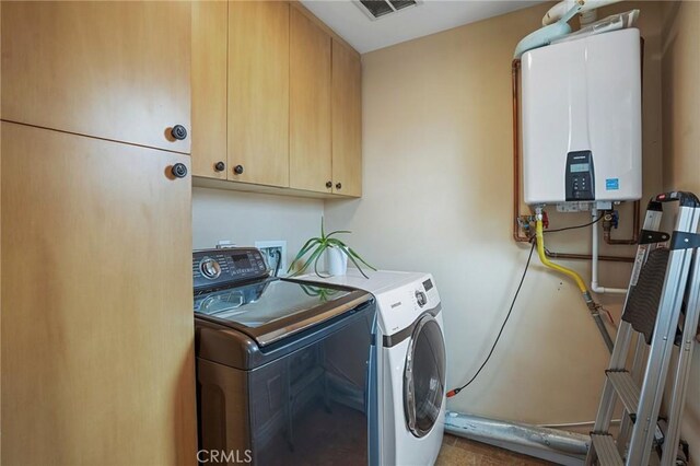 14702 Magnolia Blvd Unit 104, Sherman Oaks, CA 91403 - laundry area featuring tankless water heater, cabinet space, and washer and dryer