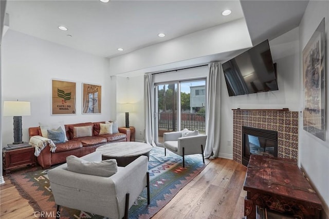 14702 Magnolia Blvd Unit 104, Sherman Oaks, CA 91403 - living area with wood-type flooring, recessed lighting, and a tiled fireplace