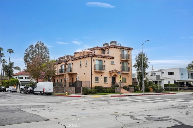 14702 Magnolia Blvd Unit 104, Sherman Oaks, CA 91403 - view of property with uncovered parking and fence
