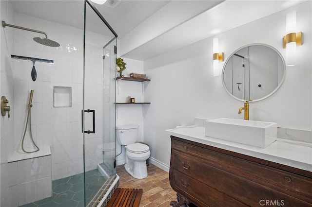 14702 Magnolia Blvd Unit 104, Sherman Oaks, CA 91403 - full bathroom featuring a stall shower, toilet, vanity, brick patterned flooring, and baseboards