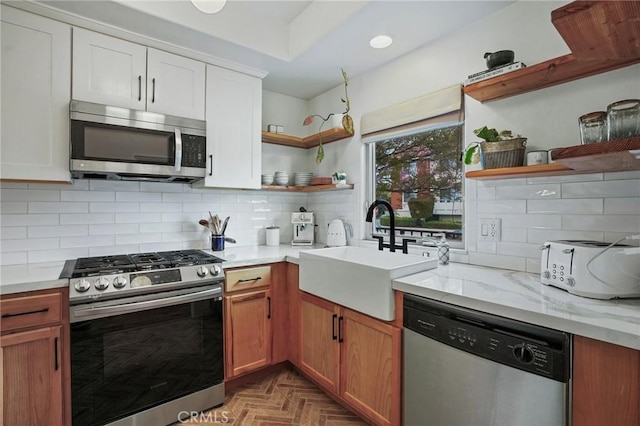 14702 Magnolia Blvd Unit 104, Sherman Oaks, CA 91403 - kitchen with open shelves, appliances with stainless steel finishes, a sink, tasteful backsplash, and recessed lighting