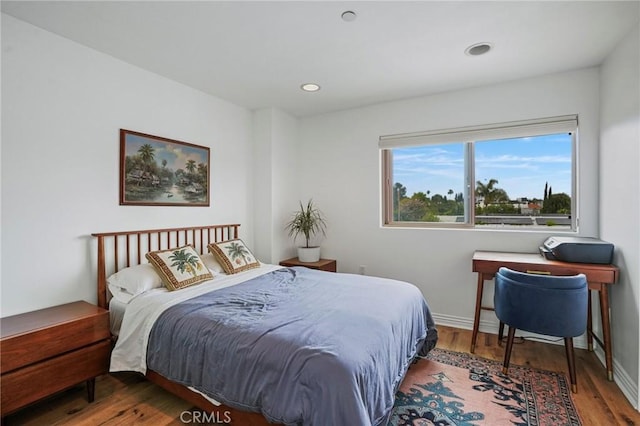 14702 Magnolia Blvd Unit 104, Sherman Oaks, CA 91403 - bedroom featuring wood finished floors, baseboards, and recessed lighting
