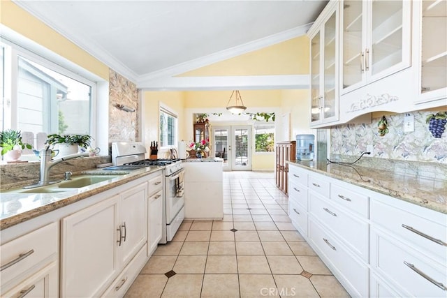 171 Brook St, San Luis Obispo, CA 93401 - kitchen featuring gas range gas stove, lofted ceiling, french doors, white cabinetry, and light tile patterned floors