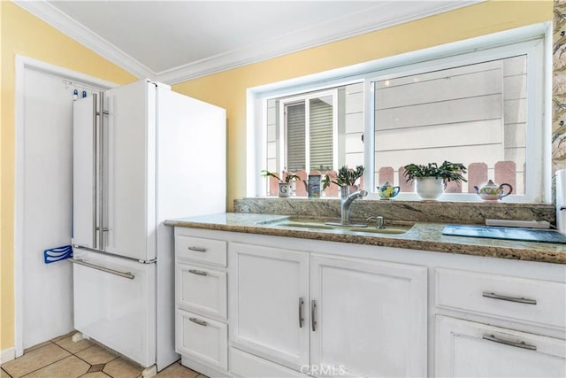 171 Brook St, San Luis Obispo, CA 93401 - kitchen featuring crown molding, freestanding refrigerator, white cabinets, stone counters, and light tile patterned floors