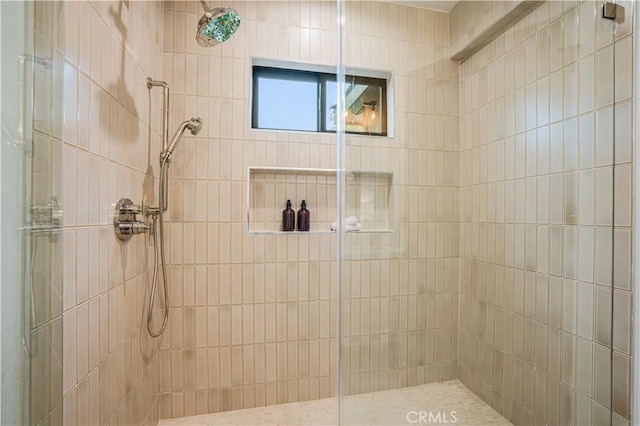 full bathroom with a tile shower