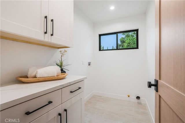 washroom with washer hookup, cabinet space, baseboards, hookup for a gas dryer, and recessed lighting