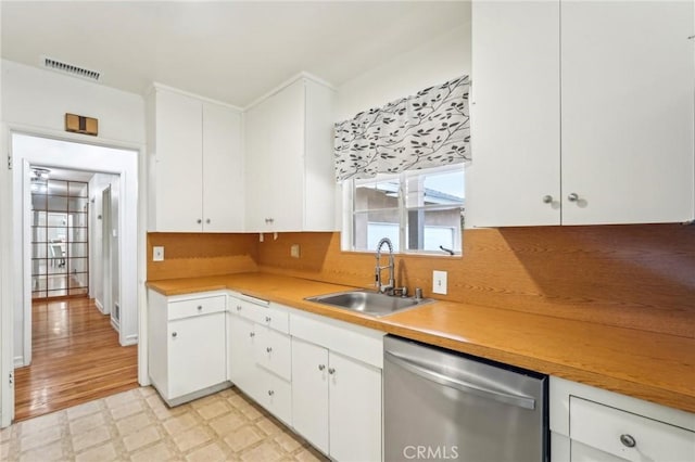 16133 Haldane St, Whittier, CA 90603 - kitchen featuring stainless steel dishwasher, a sink, light floors, white cabinets, and light countertops