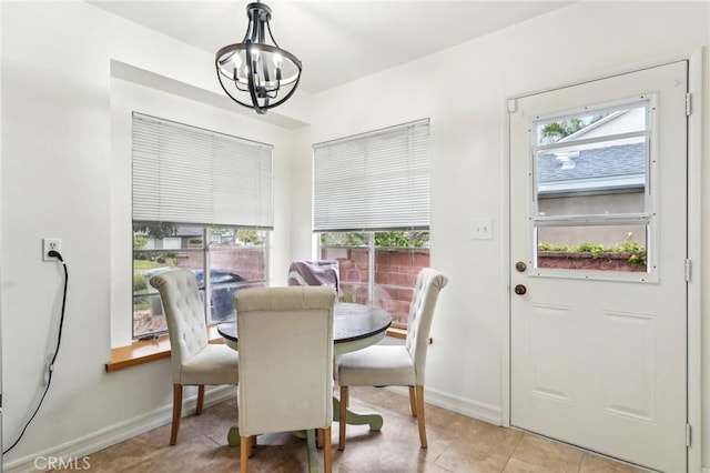 16133 Haldane St, Whittier, CA 90603 - dining space featuring a chandelier, healthy amount of natural light, baseboards, and light tile patterned flooring