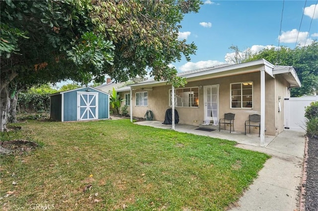 16133 Haldane St, Whittier, CA 90603 - rear view of property with stucco siding, a storage shed, a patio, and an outbuilding