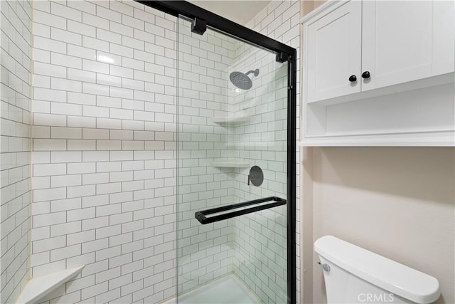full bathroom with a shower stall and toilet
