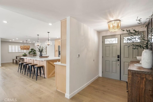 2506 E Roberta Dr, Orange, CA 92869 - foyer with a chandelier, light wood finished floors, recessed lighting, and baseboards