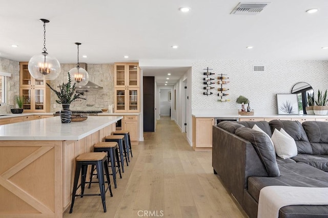2506 E Roberta Dr, Orange, CA 92869 - living room with recessed lighting, light wood-style flooring, a chandelier, and healthy amount of natural light