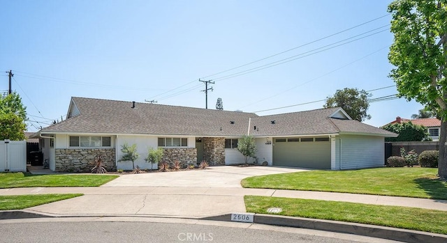 2506 E Roberta Dr, Orange, CA 92869 - single story home featuring a garage, driveway, stone siding, and roof with shingles