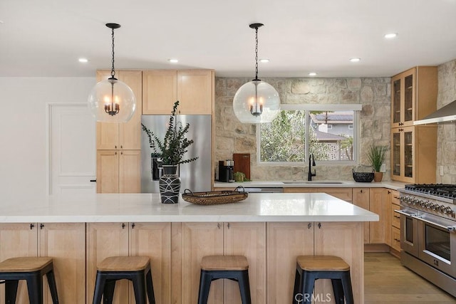2506 E Roberta Dr, Orange, CA 92869 - kitchen with appliances with stainless steel finishes, light brown cabinets, a sink, light countertops, and recessed lighting