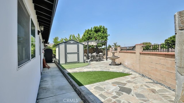 fenced backyard with a patio, a shed, and an outdoor structure
