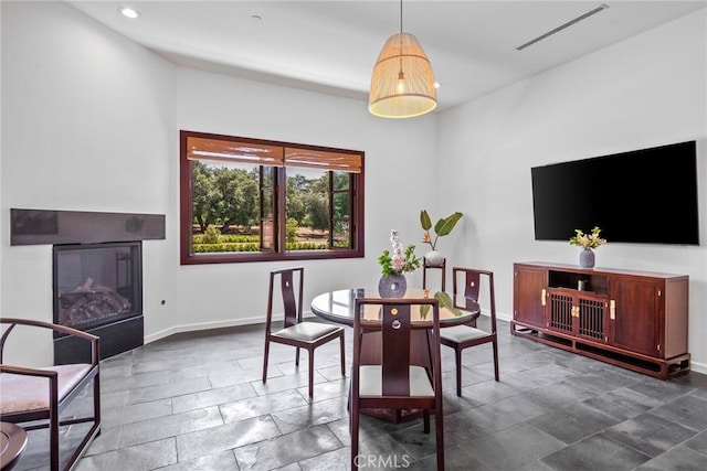 11 Deodar Ln, Bradbury, CA 91008 - dining room with baseboards, recessed lighting, a glass covered fireplace, and stone tile floors