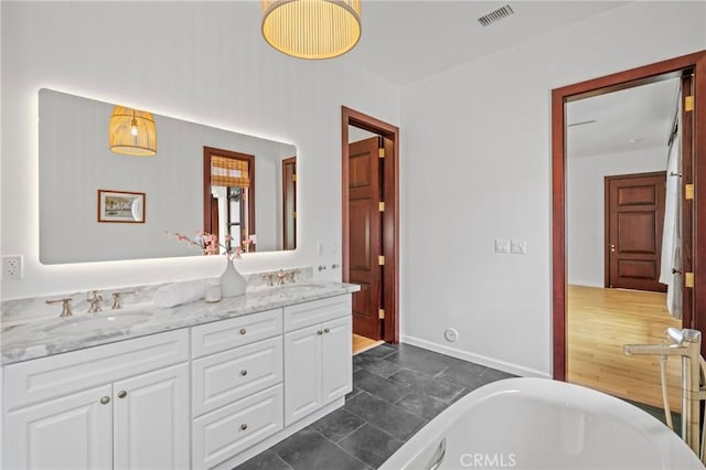 11 Deodar Ln, Bradbury, CA 91008 - bathroom featuring a soaking tub, double vanity, and baseboards