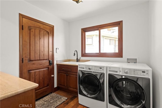 4117 Vanetta Pl, Studio City, CA 91604 - laundry area with washer and clothes dryer, dark wood-style floors, and cabinet space