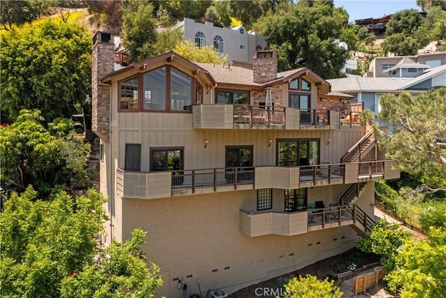 4117 Vanetta Pl, Studio City, CA 91604 - rear view of property featuring a balcony, a chimney, and stairway