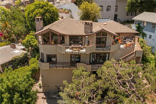 4117 Vanetta Pl, Studio City, CA 91604 - rear view of house with a chimney, a shingled roof, and stone siding