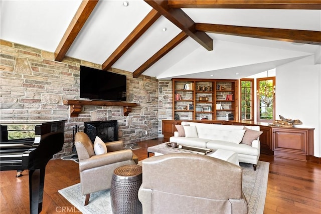 4117 Vanetta Pl, Studio City, CA 91604 - living room with wood finished floors, a stone fireplace, and built in shelves