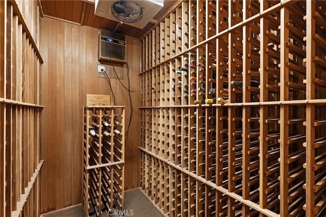 4117 Vanetta Pl, Studio City, CA 91604 - wine area featuring wood walls, carpet flooring, and an AC wall unit