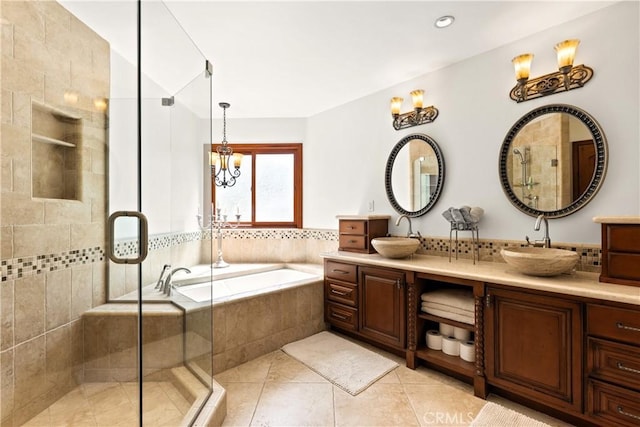 4117 Vanetta Pl, Studio City, CA 91604 - bathroom featuring double vanity, a bath, a stall shower, tile patterned flooring, and a chandelier