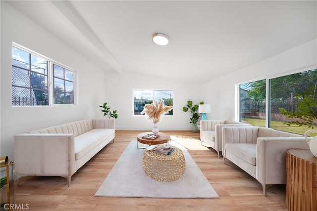 living area featuring light wood-style flooring and baseboards