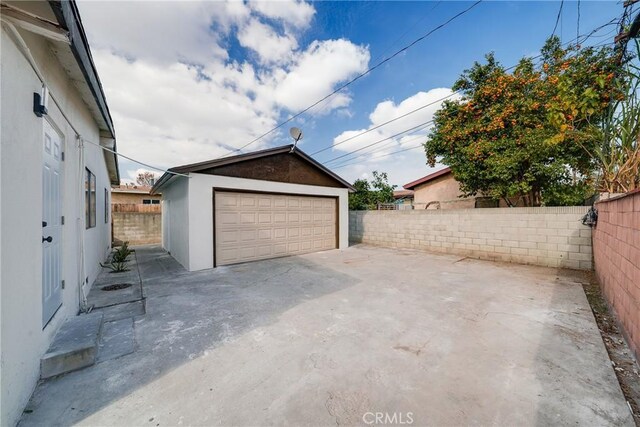 detached garage with fence