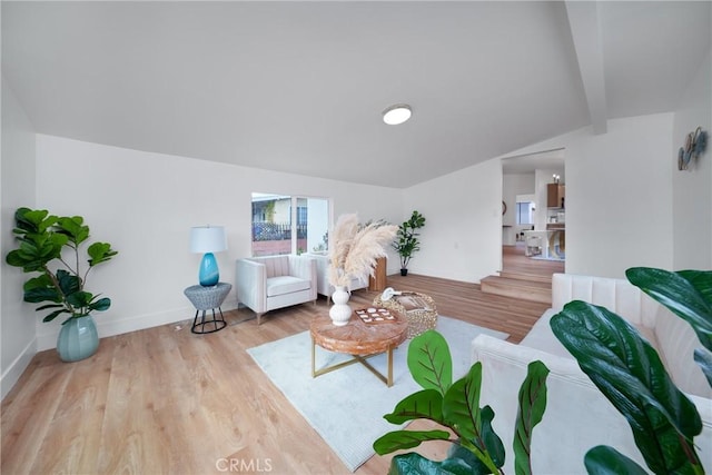 living area with wood finished floors and baseboards