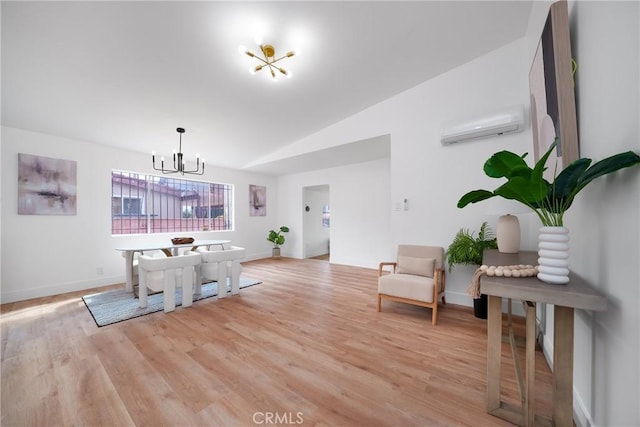 dining area featuring a wall mounted AC, a chandelier, light wood-style flooring, lofted ceiling, and baseboards