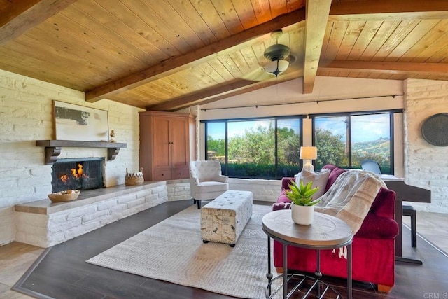 3149 Old Post Rd, Fallbrook, CA 92028 - living room with a warm lit fireplace, plenty of natural light, wood ceiling, and wood finished floors