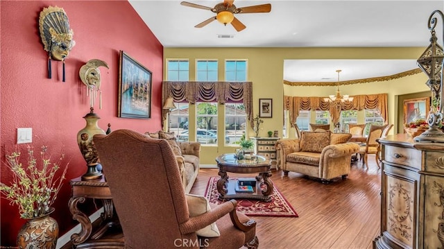 74078 W Petunia Pl, Palm Desert, CA 92211 - living area featuring ceiling fan, a chandelier, plenty of natural light, and wood finished floors