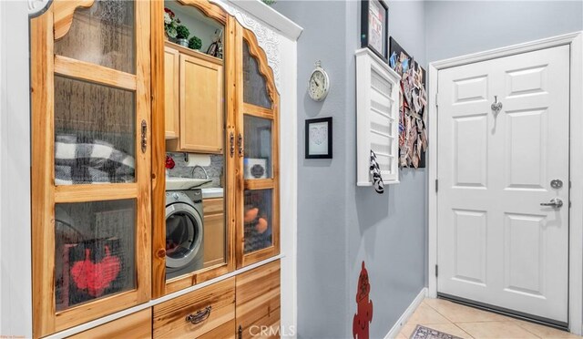 74078 W Petunia Pl, Palm Desert, CA 92211 - doorway to outside featuring light tile patterned floors, baseboards, and washer / clothes dryer