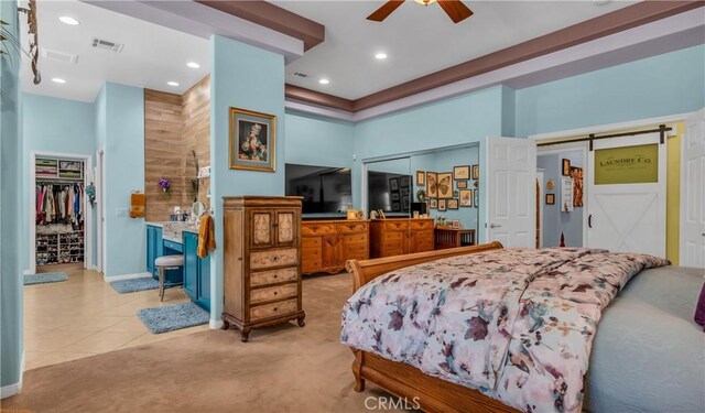 74078 W Petunia Pl, Palm Desert, CA 92211 - bedroom featuring carpet flooring, a high ceiling, a barn door, recessed lighting, and baseboards