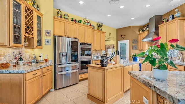 74078 W Petunia Pl, Palm Desert, CA 92211 - kitchen with stainless steel appliances, wall chimney exhaust hood, light brown cabinets, backsplash, and recessed lighting