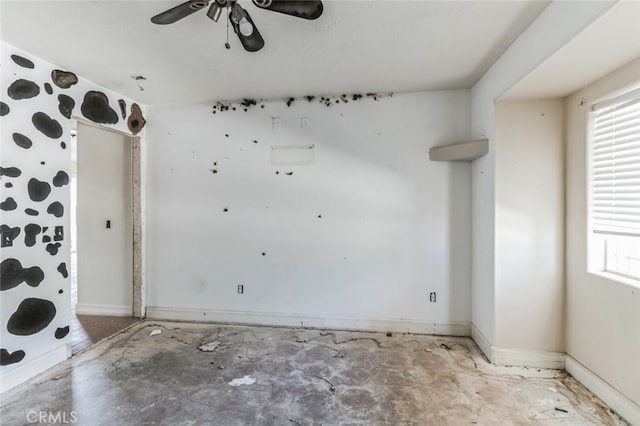 8975 Pumalo Rd, Lucerne Valley, CA 92356 - empty room with a ceiling fan, healthy amount of natural light, and baseboards