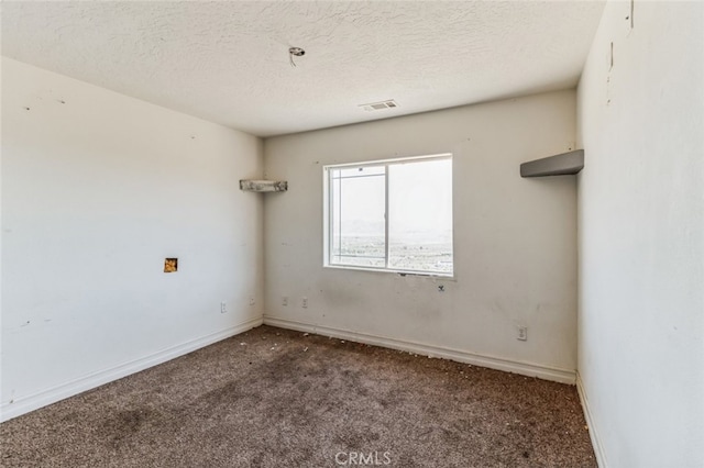 8975 Pumalo Rd, Lucerne Valley, CA 92356 - spare room featuring carpet flooring, baseboards, and a textured ceiling